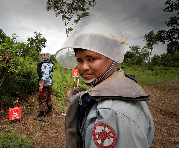 CMAC landmine workers in Cambodia, following correct procedures before detonating a landmine with C4 explosive. Credit: DFAT